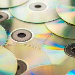 Geschichte der Musikproduktion - Bild eines Stapels Compact Discs (CDs)